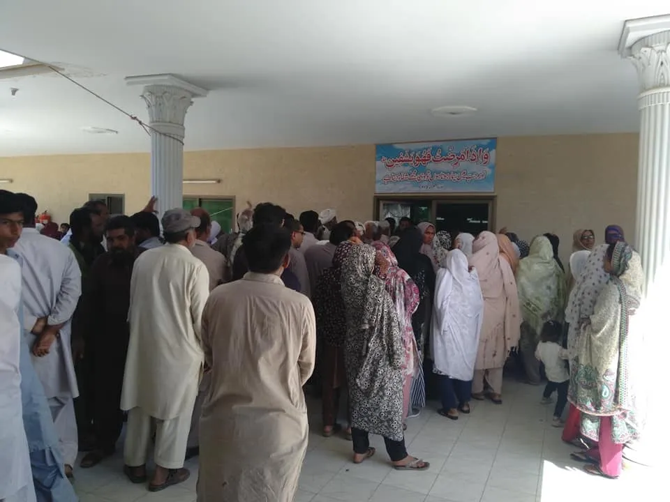 Patients queue inside Umeed (Hope) Hospital during the Health Mela